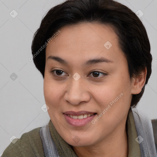 Joyful asian young-adult female with short  brown hair and brown eyes