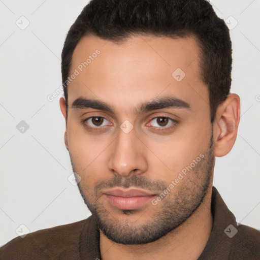 Neutral white young-adult male with short  brown hair and brown eyes