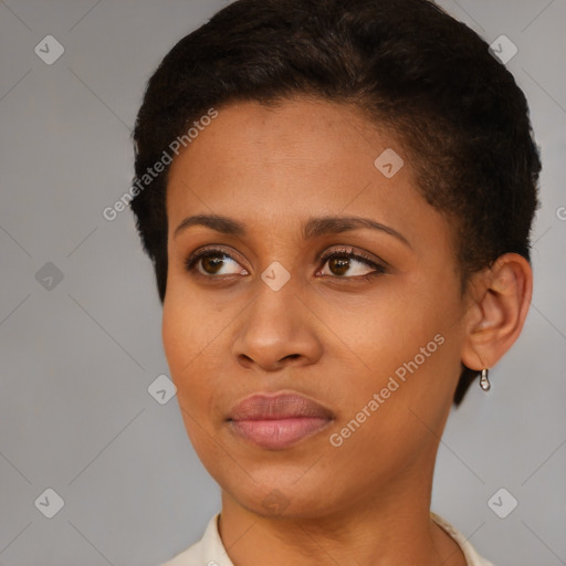 Joyful black young-adult female with short  brown hair and brown eyes