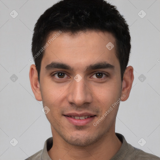 Joyful white young-adult male with short  black hair and brown eyes