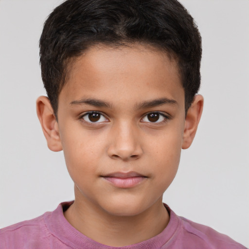 Joyful white child male with short  brown hair and brown eyes