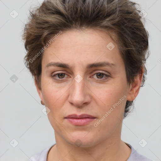 Joyful white adult female with short  brown hair and brown eyes