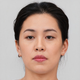 Neutral asian young-adult female with medium  brown hair and brown eyes