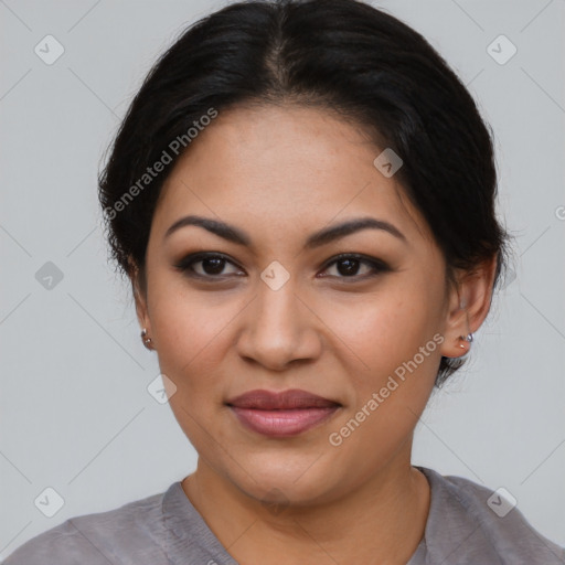 Joyful latino young-adult female with medium  brown hair and brown eyes