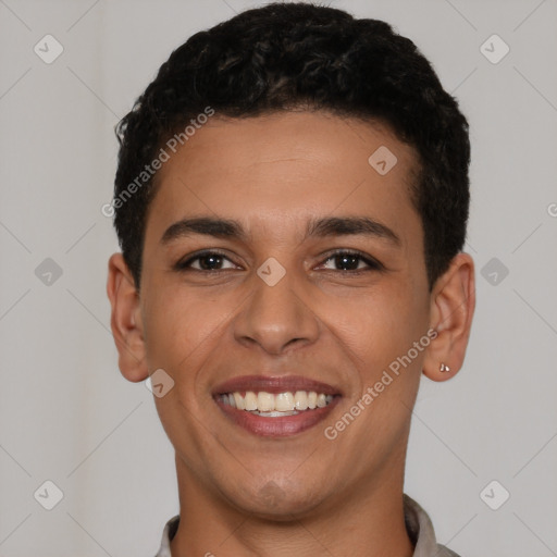 Joyful latino young-adult male with short  brown hair and brown eyes