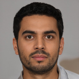 Neutral latino young-adult male with short  black hair and brown eyes