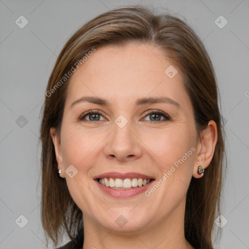 Joyful white adult female with medium  brown hair and grey eyes