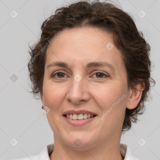 Joyful white adult female with short  brown hair and brown eyes