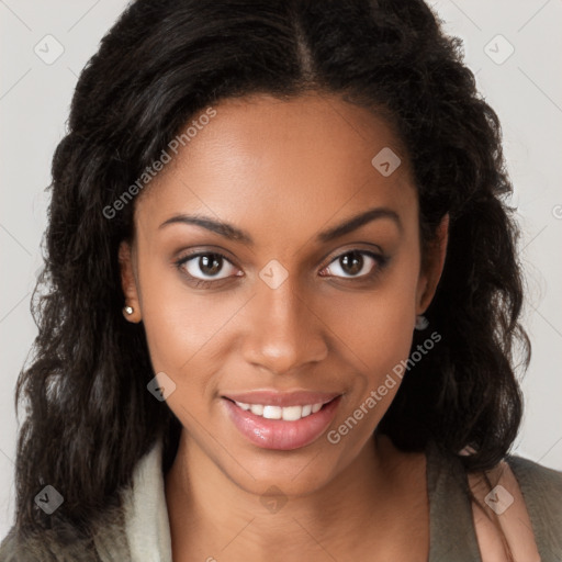 Joyful black young-adult female with long  brown hair and brown eyes