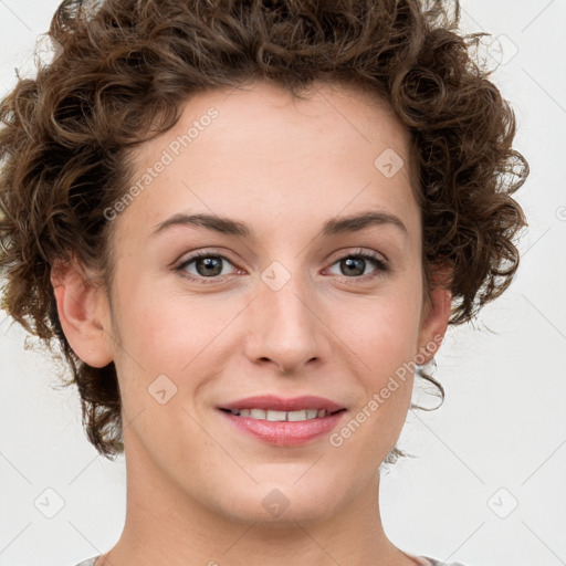 Joyful white young-adult female with medium  brown hair and green eyes