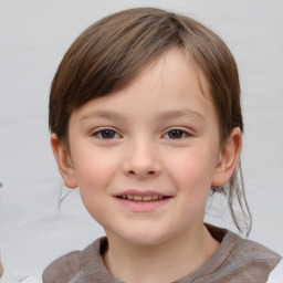 Joyful white child female with short  brown hair and brown eyes