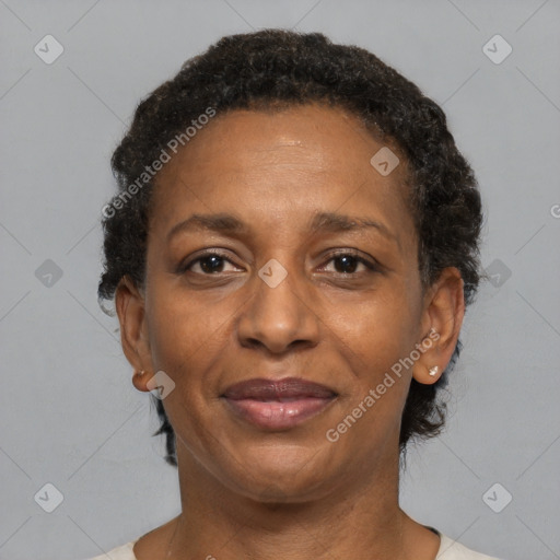 Joyful black adult female with short  brown hair and brown eyes