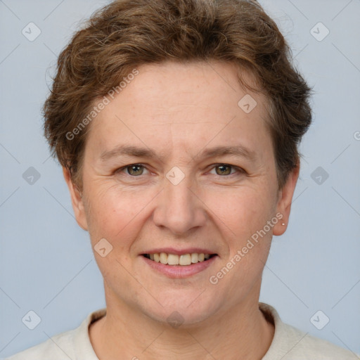 Joyful white adult female with short  brown hair and brown eyes