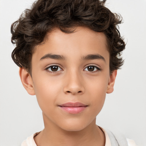 Joyful white child male with short  brown hair and brown eyes