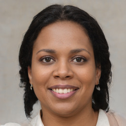 Joyful black young-adult female with medium  brown hair and brown eyes