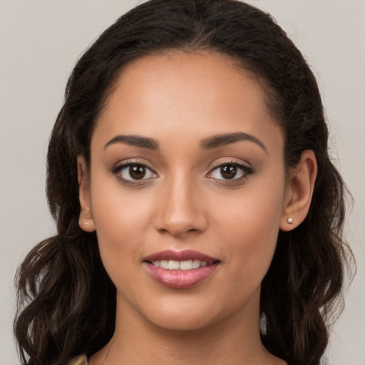 Joyful white young-adult female with long  brown hair and brown eyes