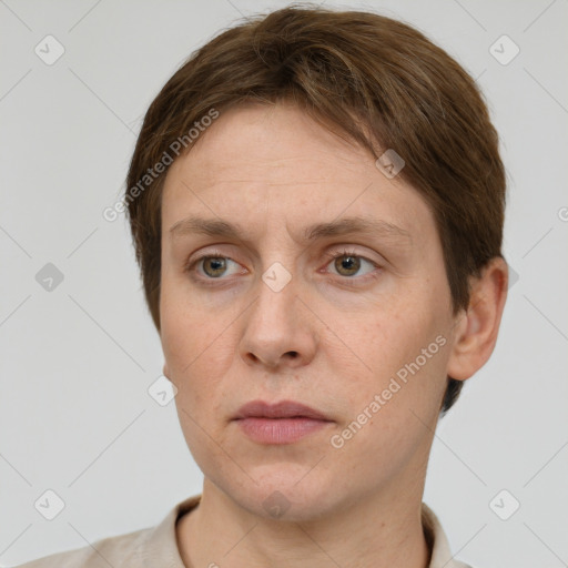 Neutral white adult female with short  brown hair and grey eyes