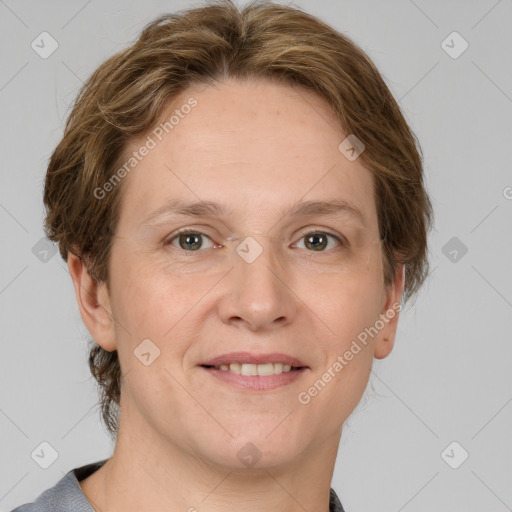 Joyful white adult female with medium  brown hair and grey eyes