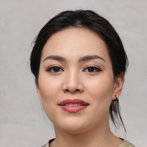 Joyful white young-adult female with medium  black hair and brown eyes