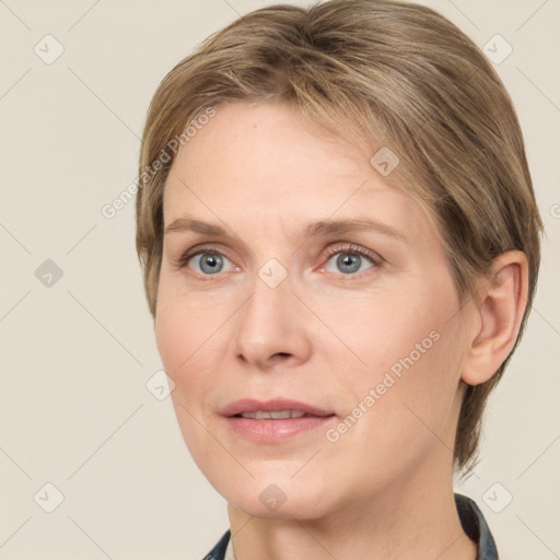 Joyful white adult female with medium  brown hair and grey eyes