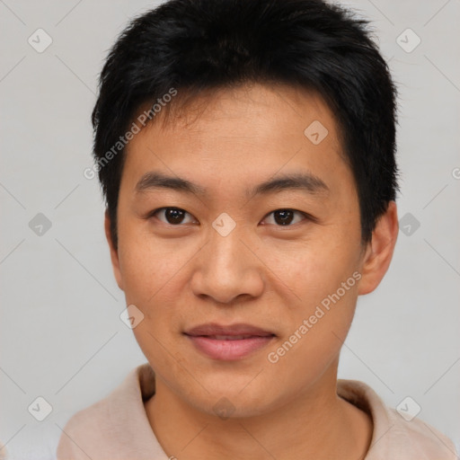 Joyful asian young-adult male with short  brown hair and brown eyes