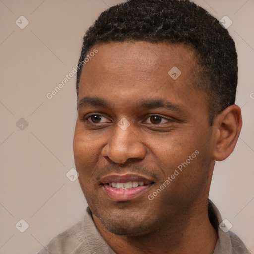 Joyful black young-adult male with short  black hair and brown eyes
