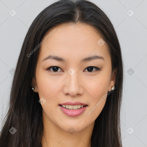 Joyful asian young-adult female with long  brown hair and brown eyes