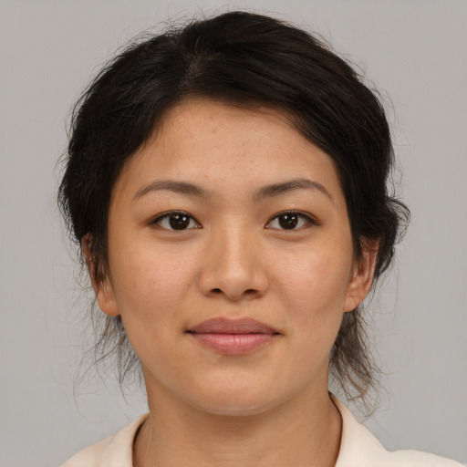 Joyful asian young-adult female with medium  brown hair and brown eyes
