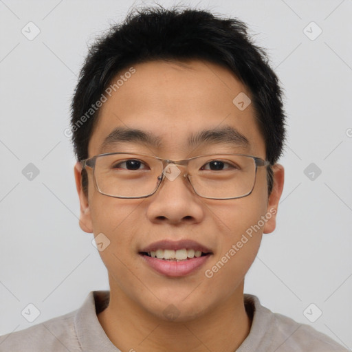 Joyful asian young-adult male with short  brown hair and brown eyes