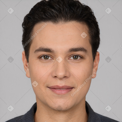 Joyful white young-adult male with short  black hair and brown eyes