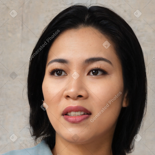 Joyful asian young-adult female with medium  black hair and brown eyes