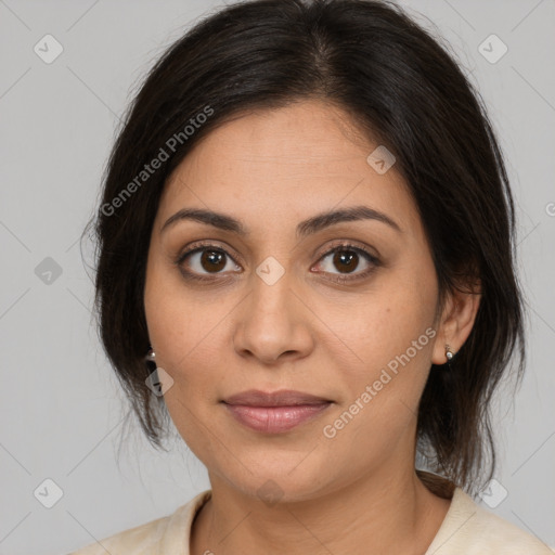 Joyful latino young-adult female with medium  brown hair and brown eyes