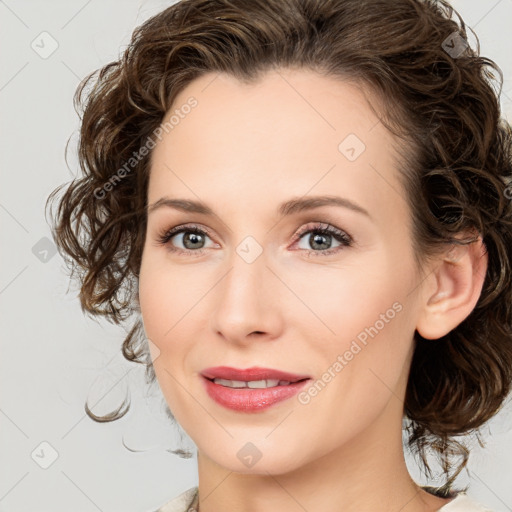 Joyful white young-adult female with medium  brown hair and green eyes