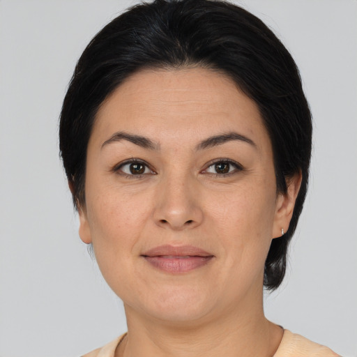 Joyful white adult female with medium  brown hair and brown eyes