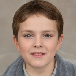 Joyful white child male with short  brown hair and brown eyes