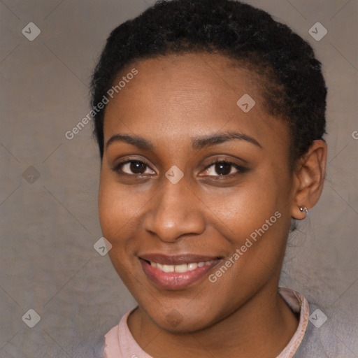 Joyful black young-adult female with short  brown hair and brown eyes