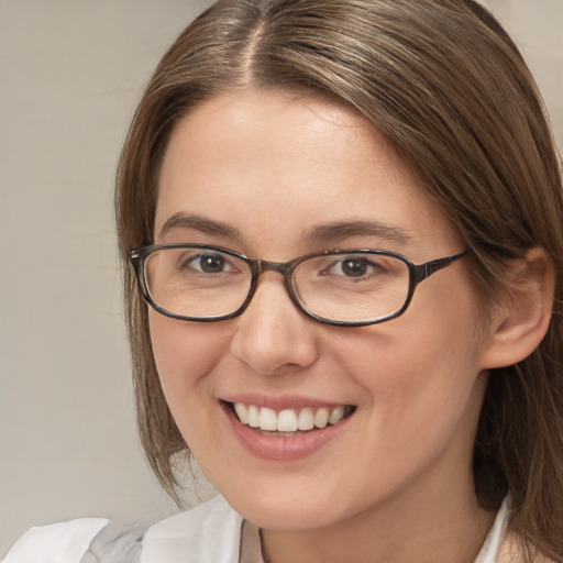 Joyful white young-adult female with medium  brown hair and brown eyes