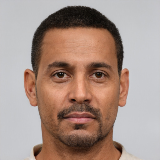 Neutral black adult male with short  brown hair and brown eyes