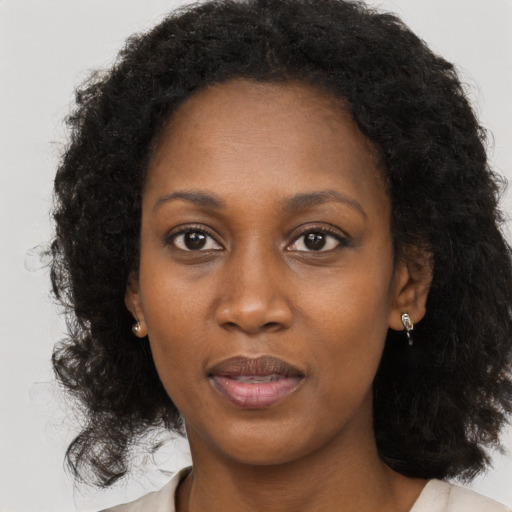 Neutral black young-adult female with long  black hair and brown eyes