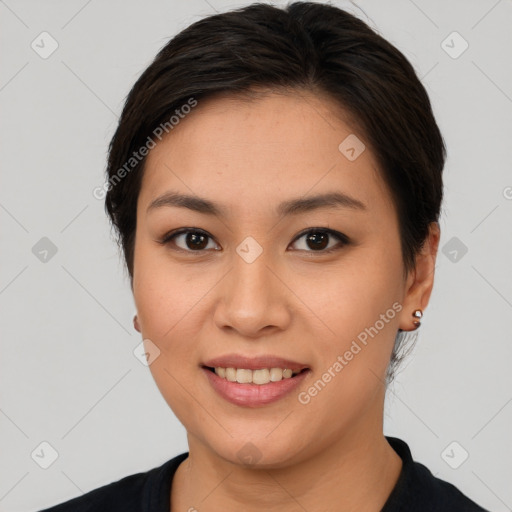 Joyful asian young-adult female with short  brown hair and brown eyes