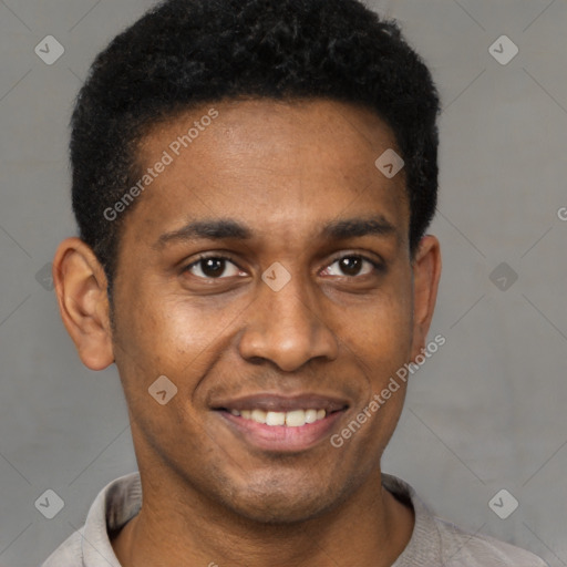 Joyful black young-adult male with short  black hair and brown eyes