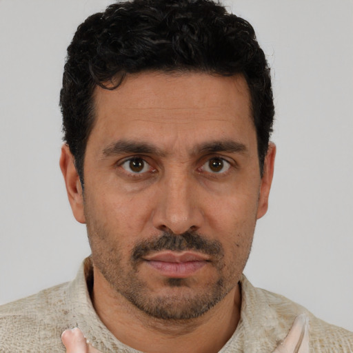 Neutral white young-adult male with short  black hair and brown eyes