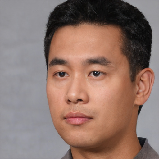 Neutral asian young-adult male with short  black hair and brown eyes