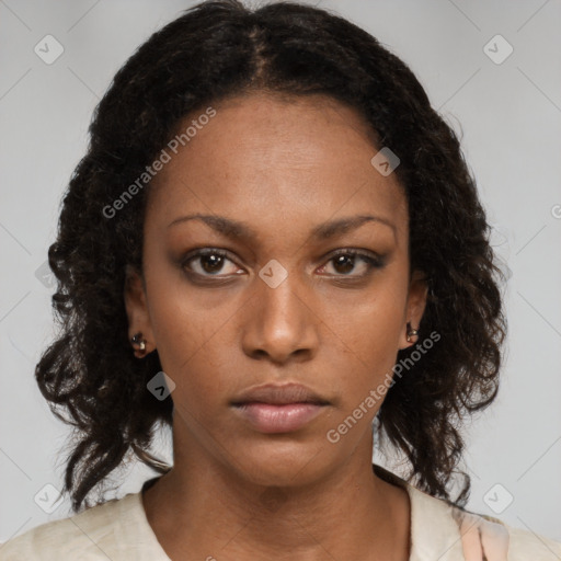 Neutral black young-adult female with long  brown hair and brown eyes