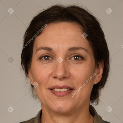 Joyful white adult female with medium  brown hair and grey eyes