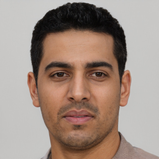 Neutral latino young-adult male with short  black hair and brown eyes