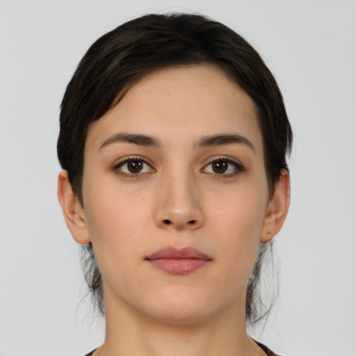 Neutral white young-adult female with short  brown hair and brown eyes