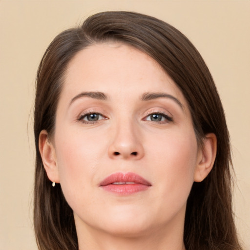 Joyful white young-adult female with long  brown hair and grey eyes