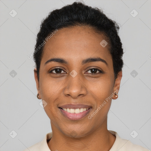 Joyful black young-adult female with short  black hair and brown eyes