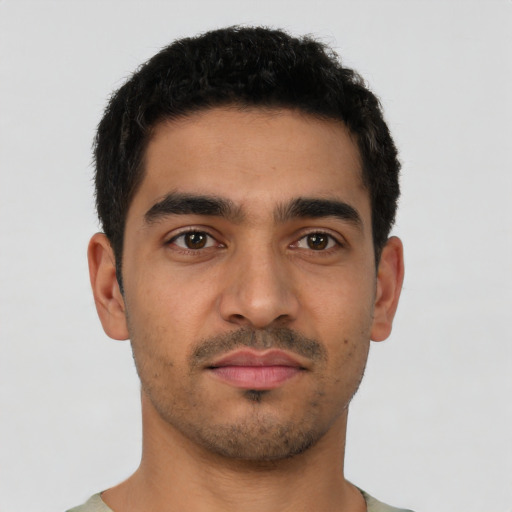 Neutral latino young-adult male with short  brown hair and brown eyes